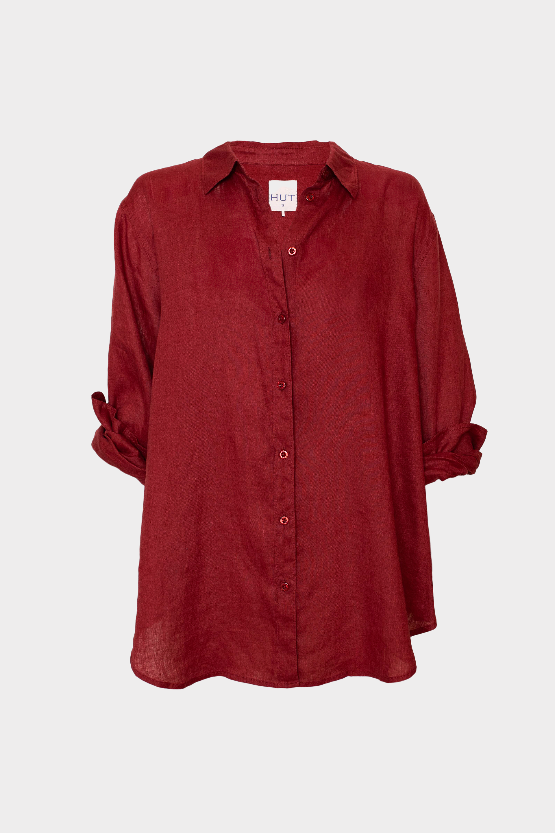 Hut Red button-up shirt on a white background