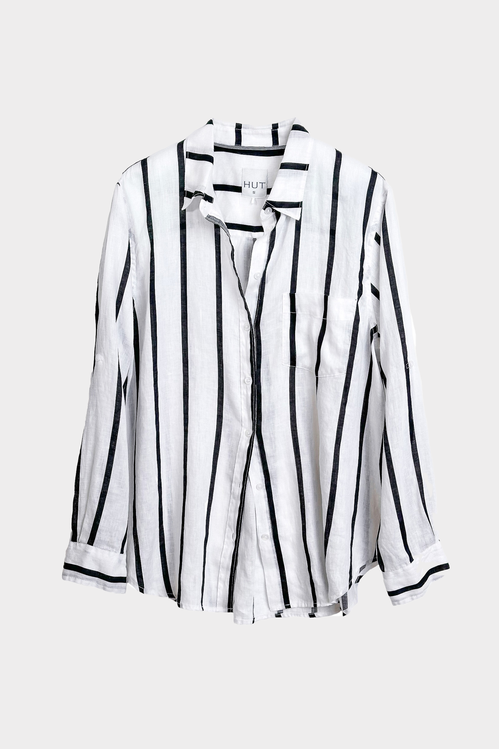 Black and white striped Hut clothing boyfriend linen shirt on a light gray background