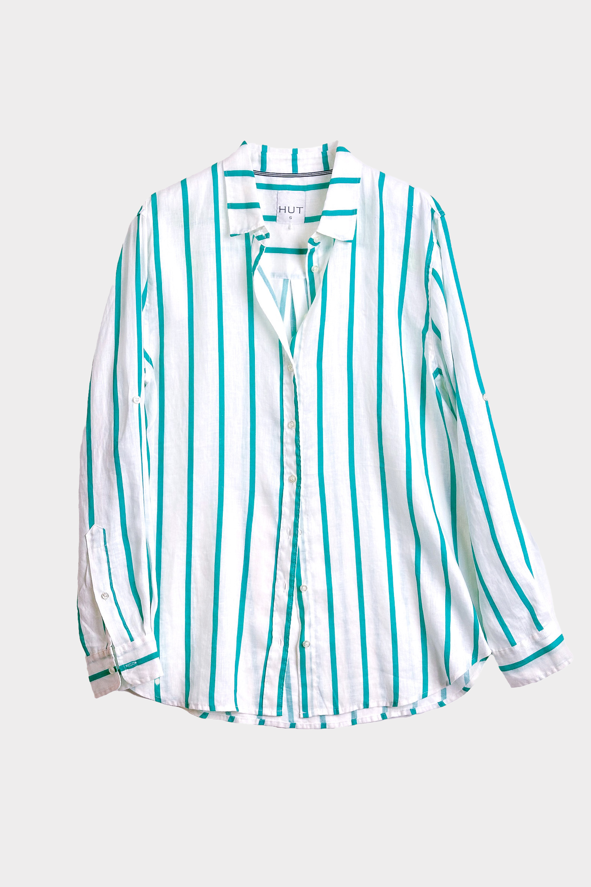 Striped linen boyfriend shirt with turquoise stripe and white base on a light gray background