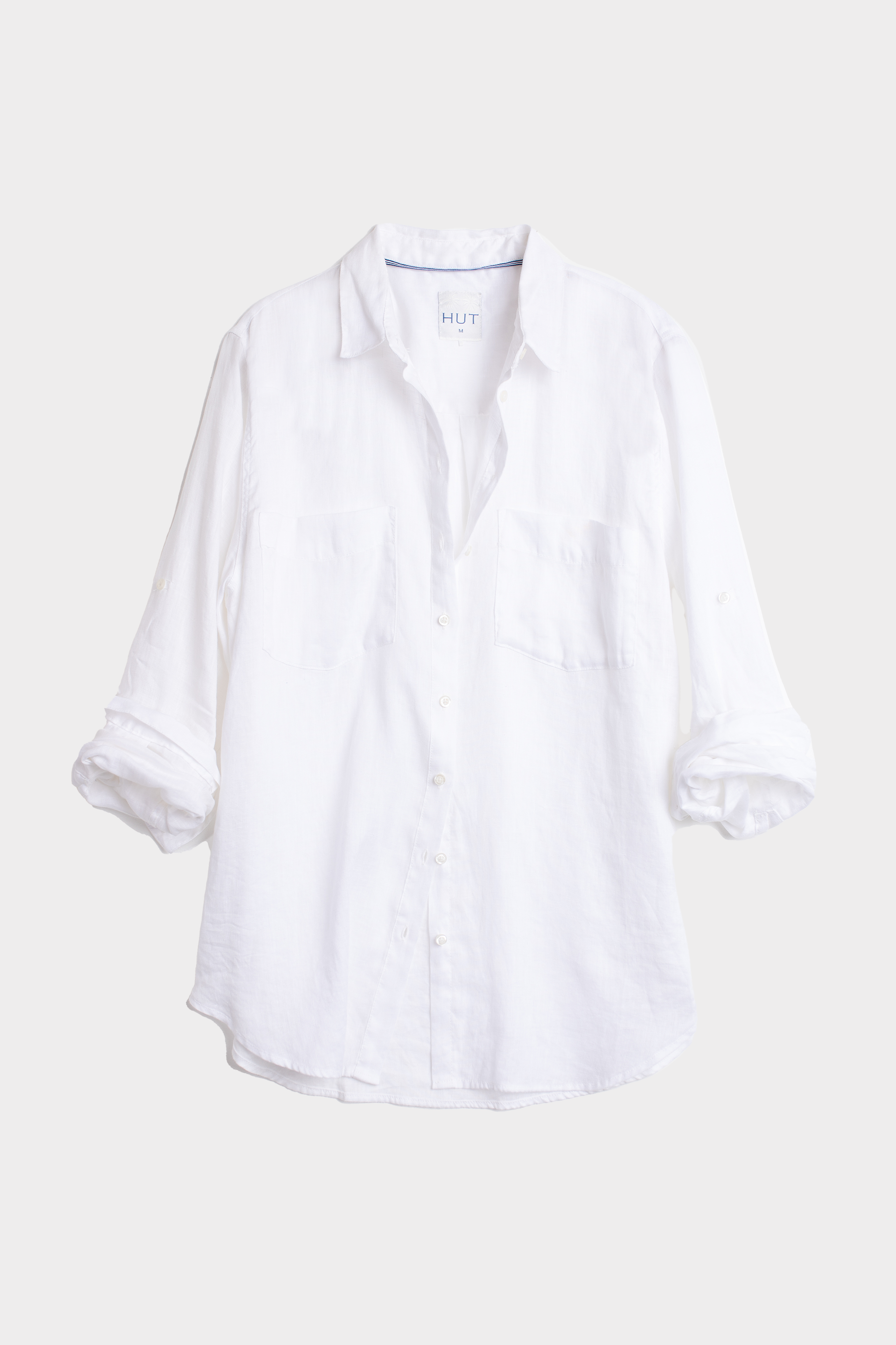 White linen boyfriend shirt on a light gray background