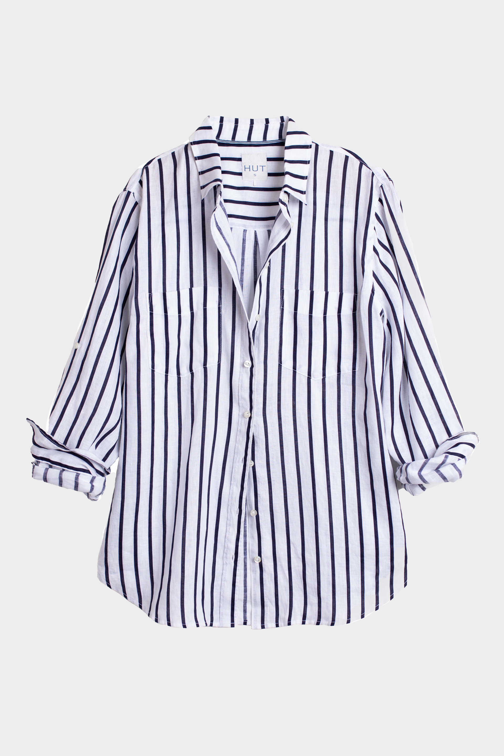 Navy and White Striped organic boyfriend linen shirt with two chest pockets and tab sleeves on a light gray background