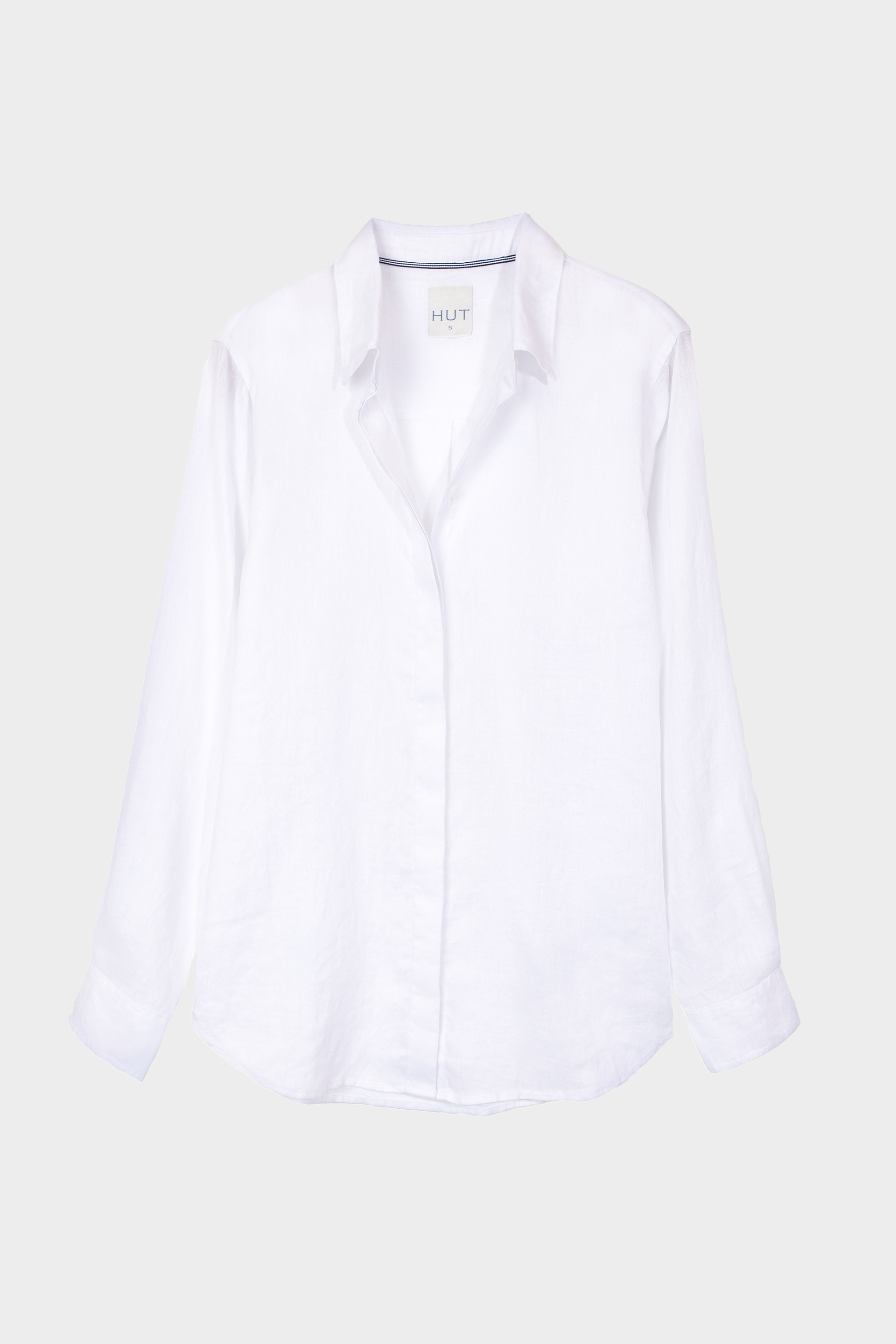 White hidden placket boyfriend linen shirt on a light gray background