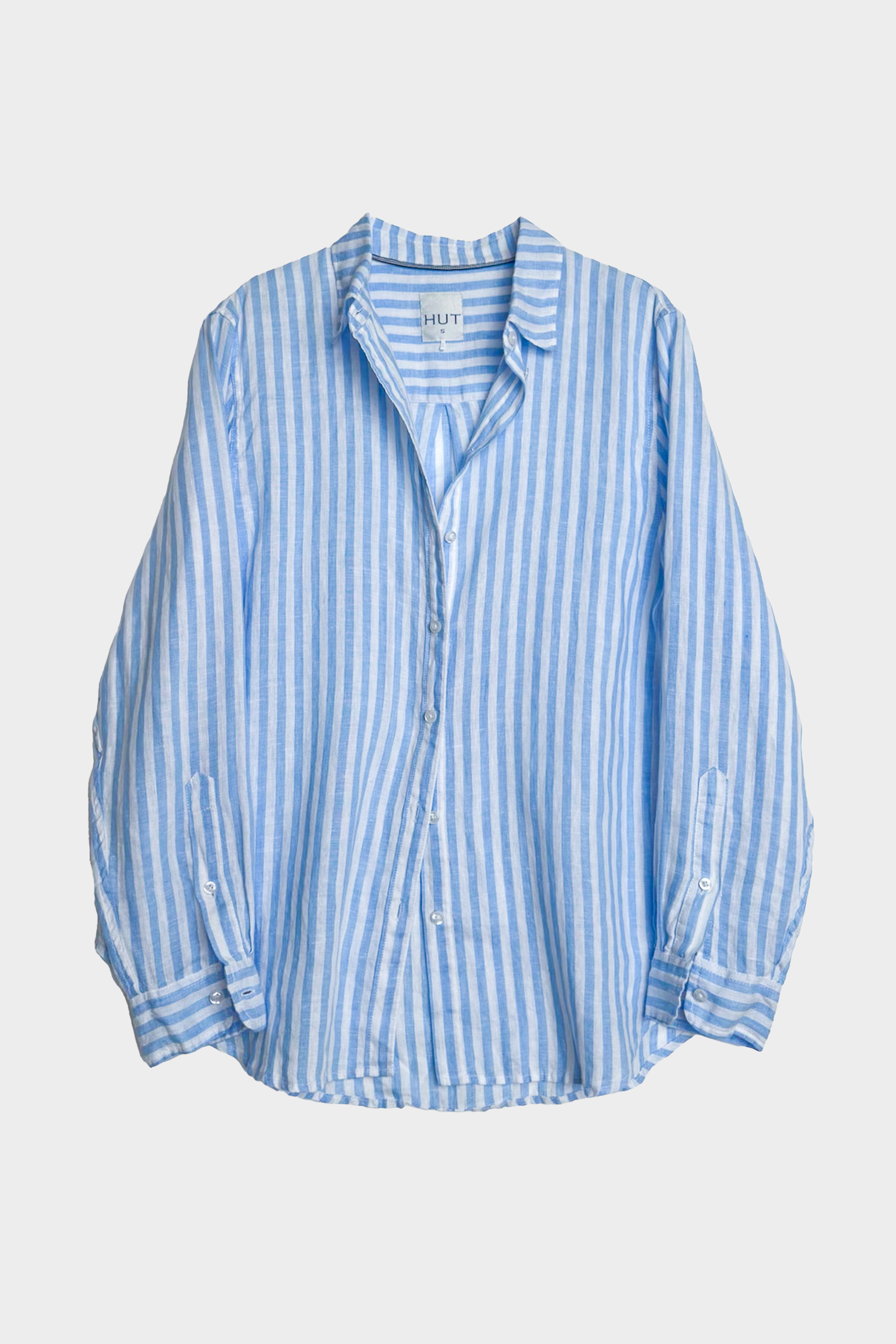 Hut Clothing Blue and white striped boyfriend linen shirt on a light gray background