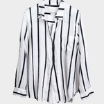 Black and white striped Hut clothing boyfriend linen shirt on a light gray background