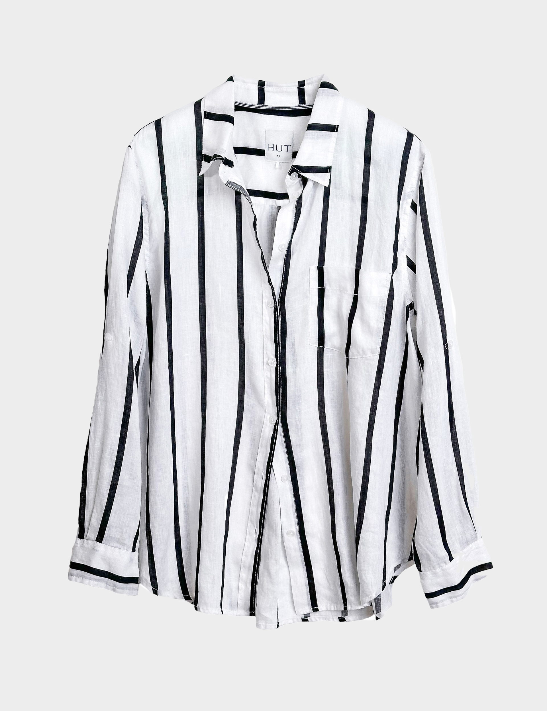 Black and white striped Hut clothing boyfriend linen shirt on a light gray background