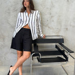 A black and white striped oversized boyfriend linen shirt with black linen shorts