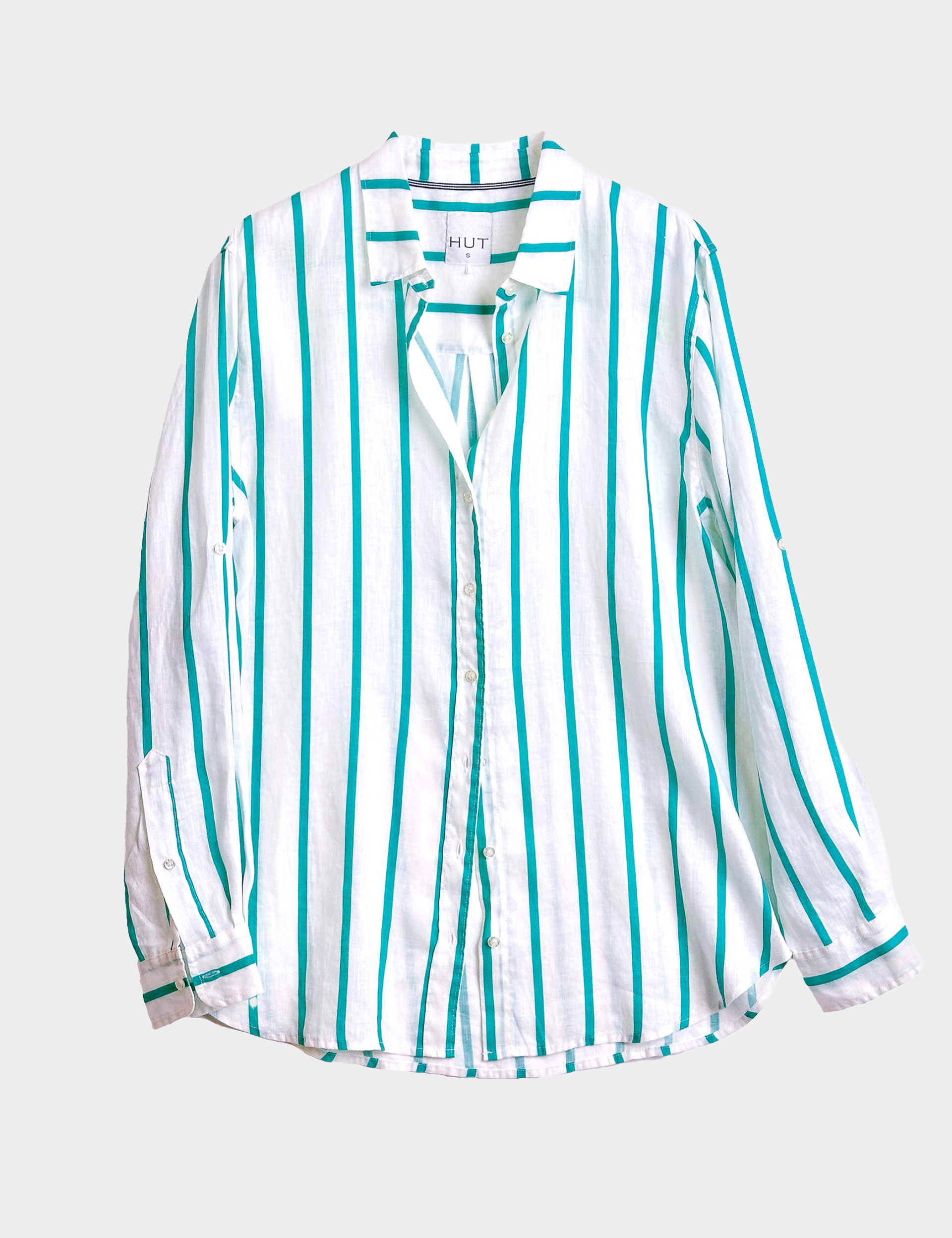 Striped linen boyfriend shirt with turquoise stripe and white base on a light gray background