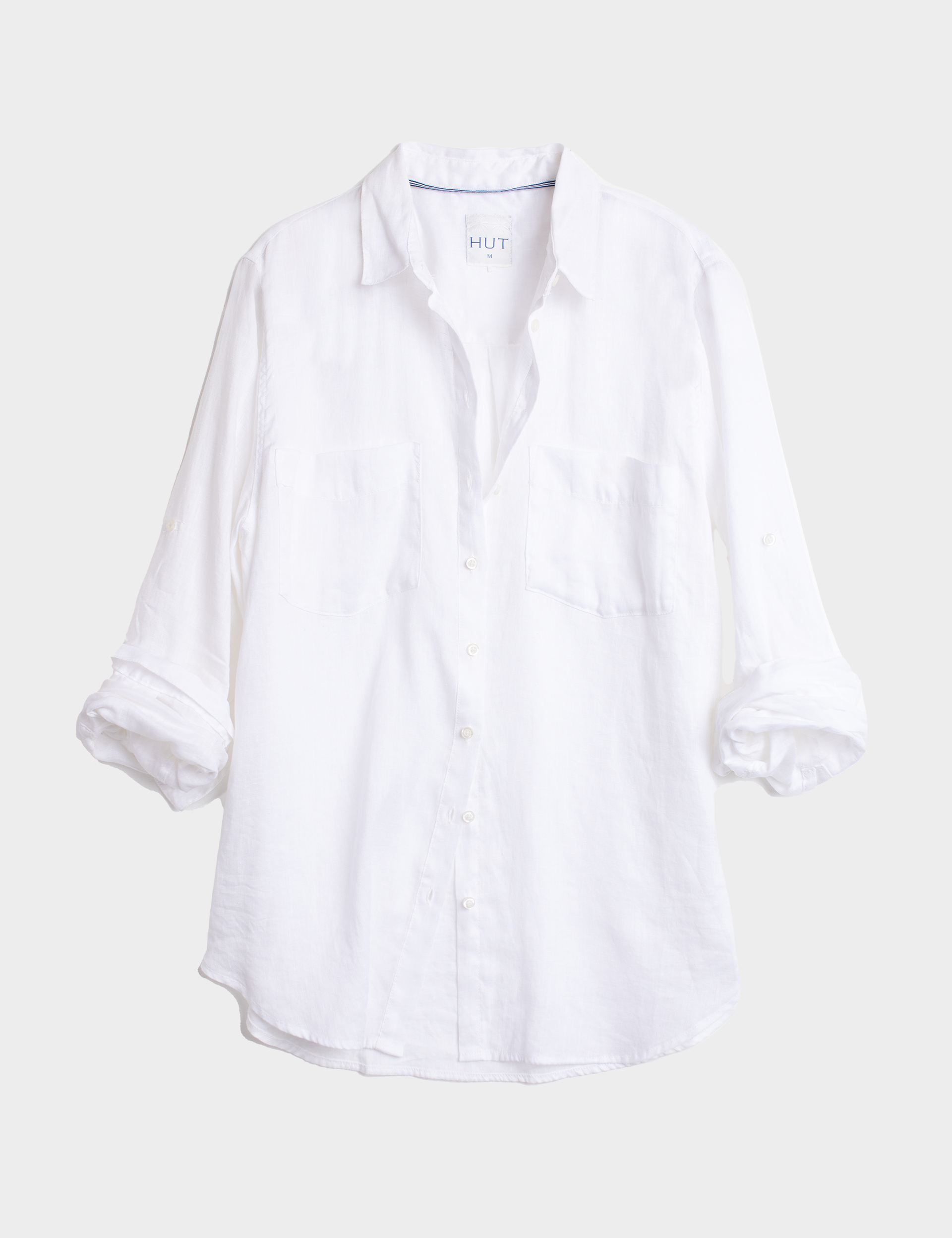 White linen boyfriend shirt on a light gray background