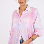 Model wearing a Hut clothing lilac plaid boyfriend linen shirt with two chest pockets and her hand in denim jean pocket 