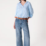Model wearing Hut Sky Blue Stripe Boyfriend Linen Shirt with denim jeans and sandals 