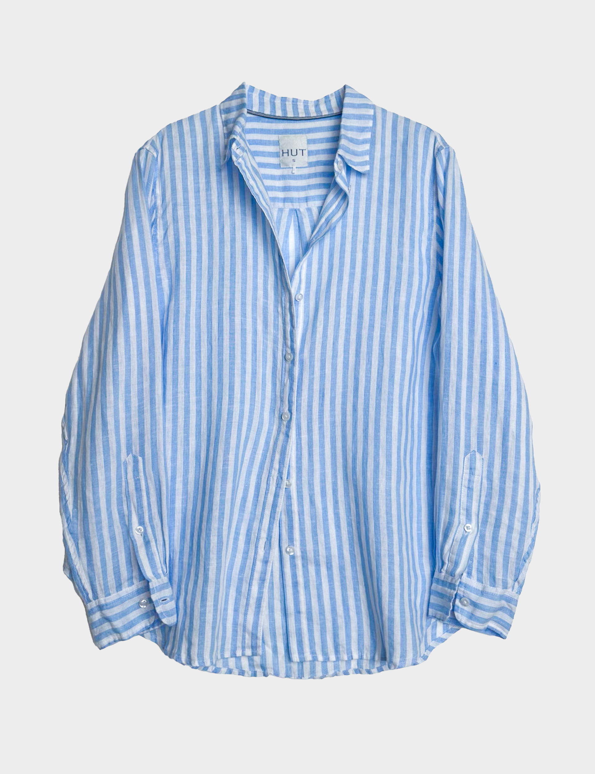 Hut Clothing Blue and white striped boyfriend linen shirt on a light gray background